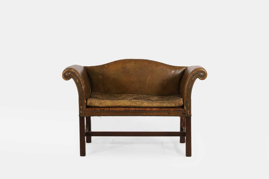 A small leather-upholstered camelback sofa, late 19th/early 20th century, (1 of 4)