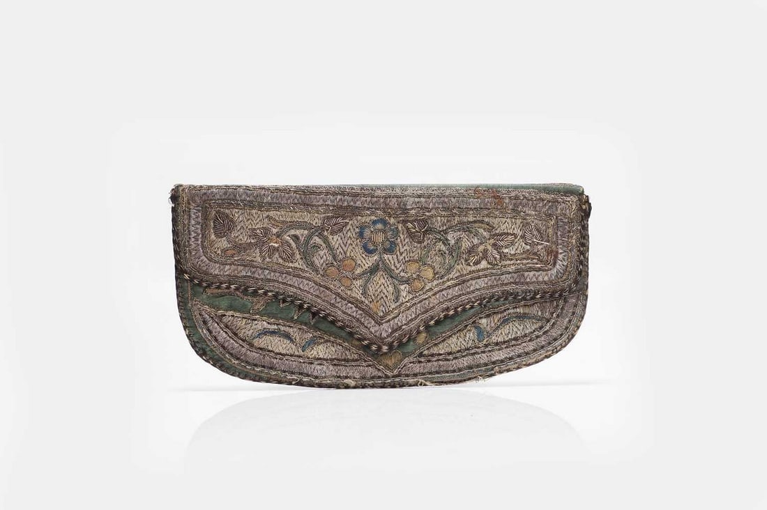An Ottoman metal thread, silk and velvet embroidered purse, 19th century, Turkish,: An Ottoman metal thread, silk and velvet embroidered purse, 19th century, Turkish, of softened rectangular form with a cusped flap, the green silk ground profusely decorated in silver and gilt threads