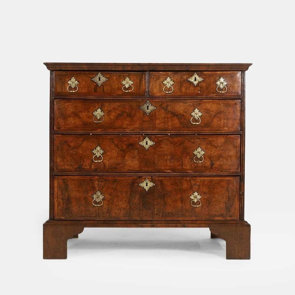 A walnut and feather-banded chest of drawers, early 18th century and later, (1 of 6)