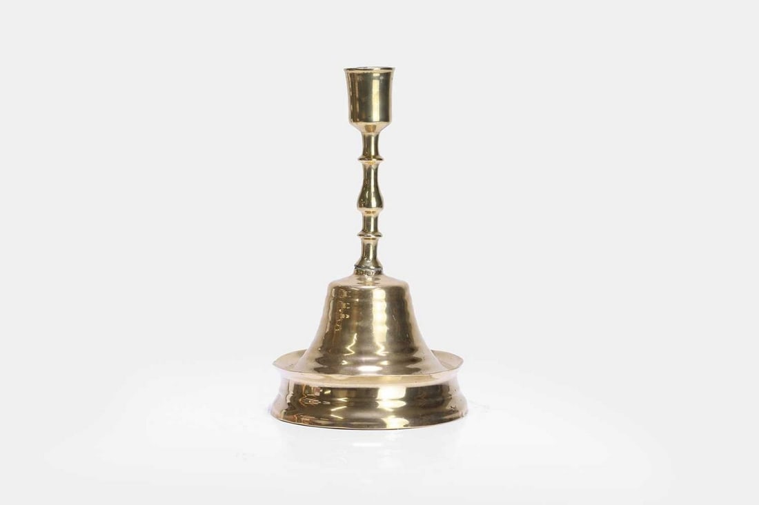 A brass candlestick, 16th century, (1 of 3)