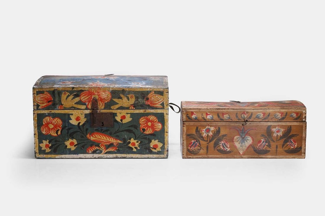 Two folk art painted marriage chests, mid to late 19th century, French, Rouen,: Two folk art painted marriage chests, mid to late 19th century, French, Rouen, each with a domed top and all-over floral and swag decoration, the larger bearing a stamp (larger 44.5cm wide, 30.5cm dee