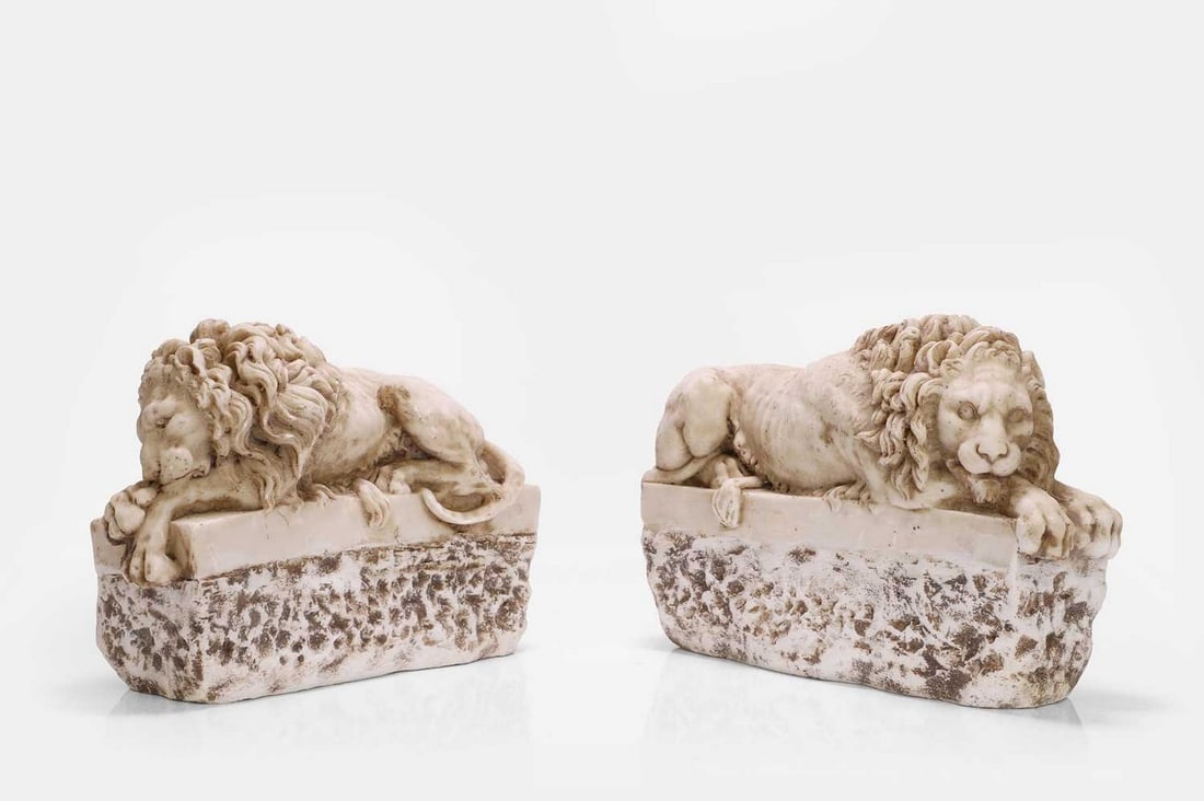 A pair of alabaster lion bookends, of recent manufacture, Italian, (1 of 3)