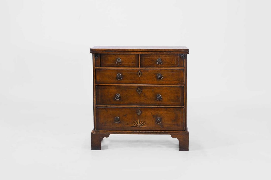A George I-style walnut and inlaid bachelor’s chest, early 18th century and later, (1 of 7)
