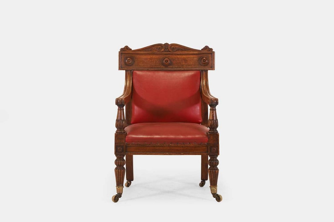 A large George IV oak library armchair, c.1830, (1 of 5)