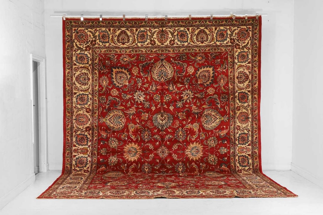 A Tabriz wool carpet, mid-20th century, Persian,: A Tabriz wool carpet, mid-20th century, Persian, the field with an all-over design with bold Shah Abbasi motifs to a red ground (447 x 327cm)