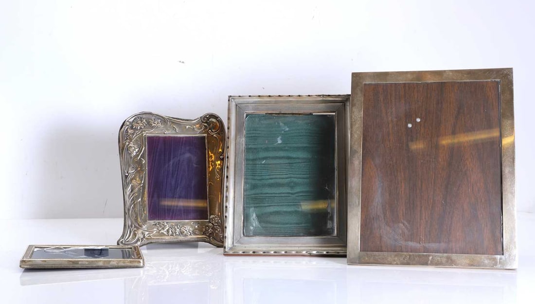 A group of four silver photograph frames, (1 of 1)