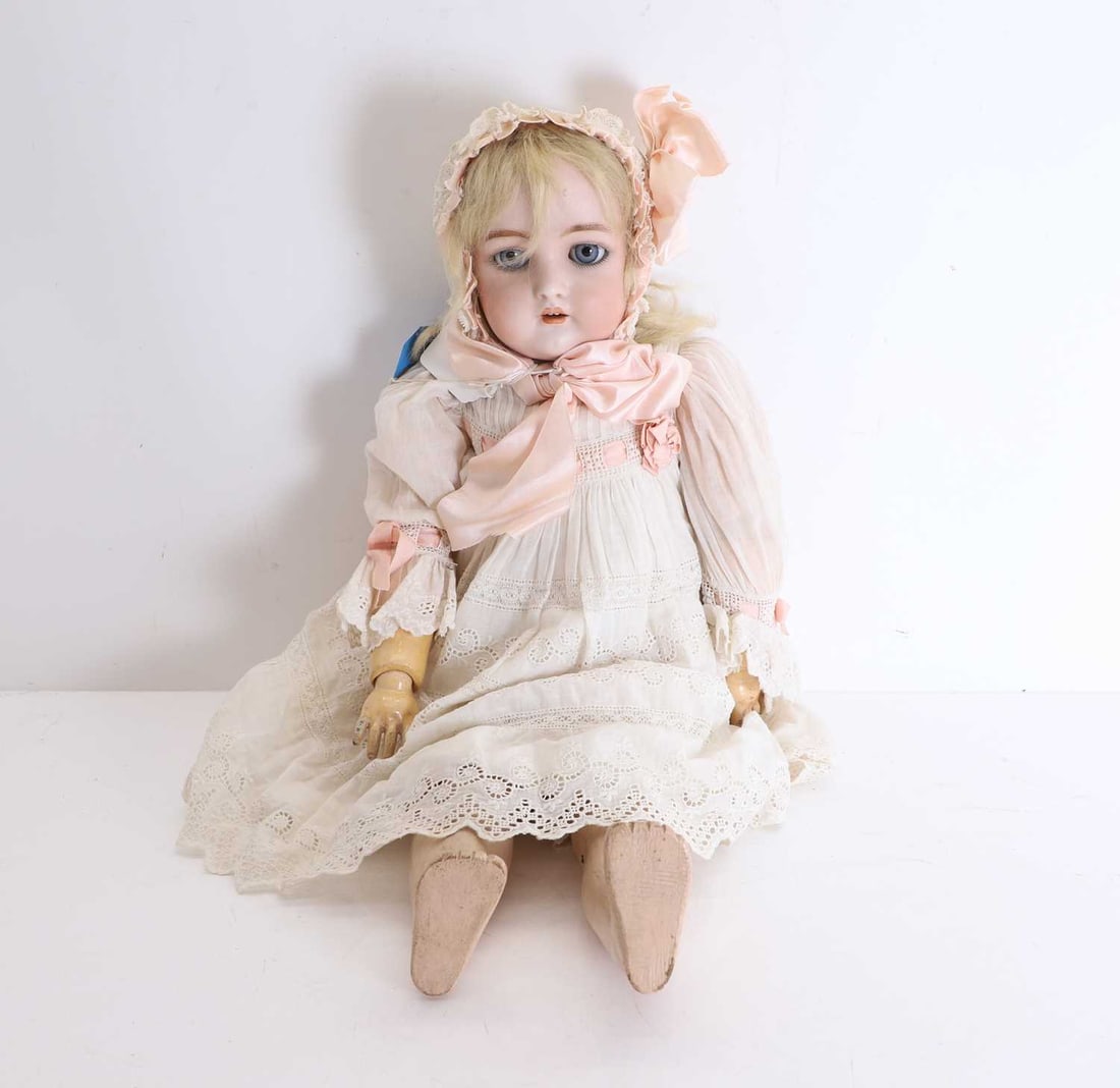 A late Victorian bisque headed doll, 20th century, (1 of 2)