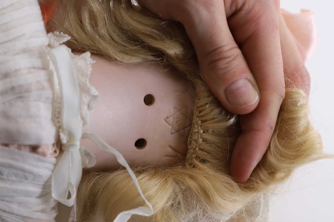 A late Victorian bisque headed doll, 20th century, - 2