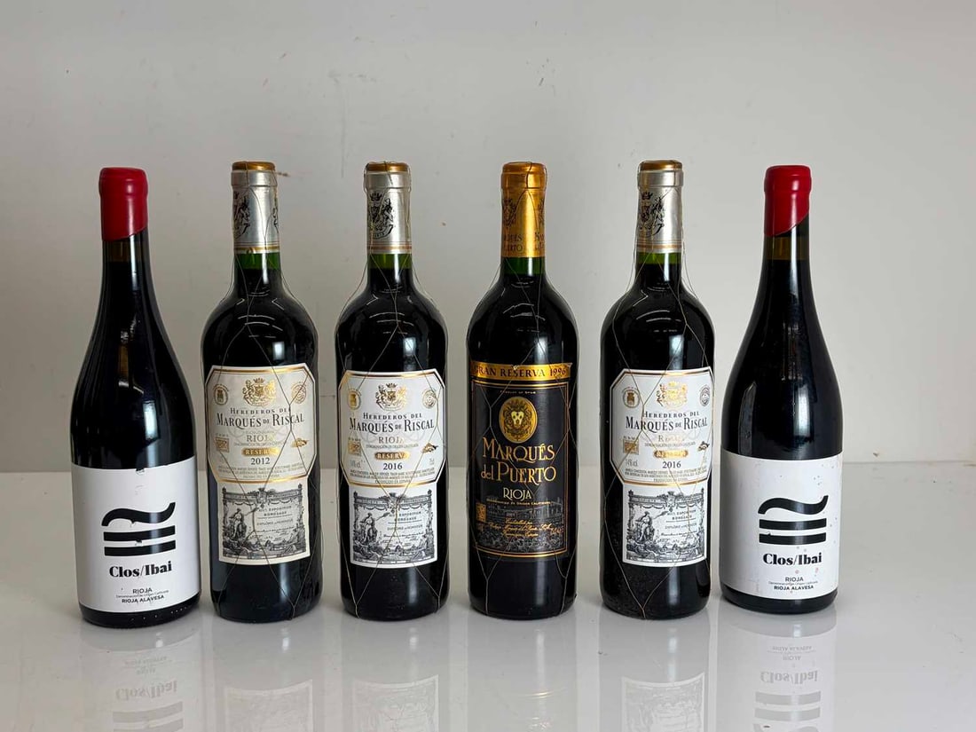 A selection of Spanish red wines,: A selection of Spanish red wines, assorted makers and vintages, as per photographs (12 bottles in total)Shipping Disclaimer: Please note we cannot guarantee condition of contents or quality of
