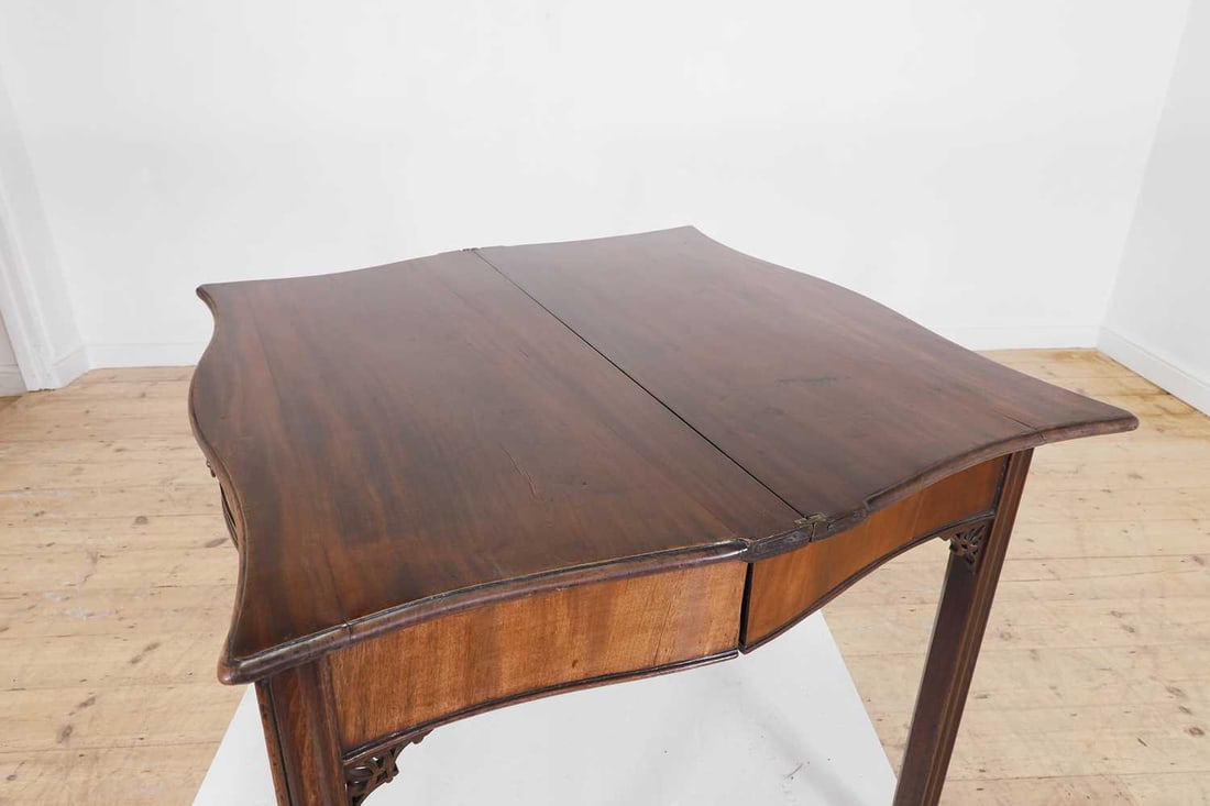 A George III mahogany serpentine tea table, circa 1760, - 7