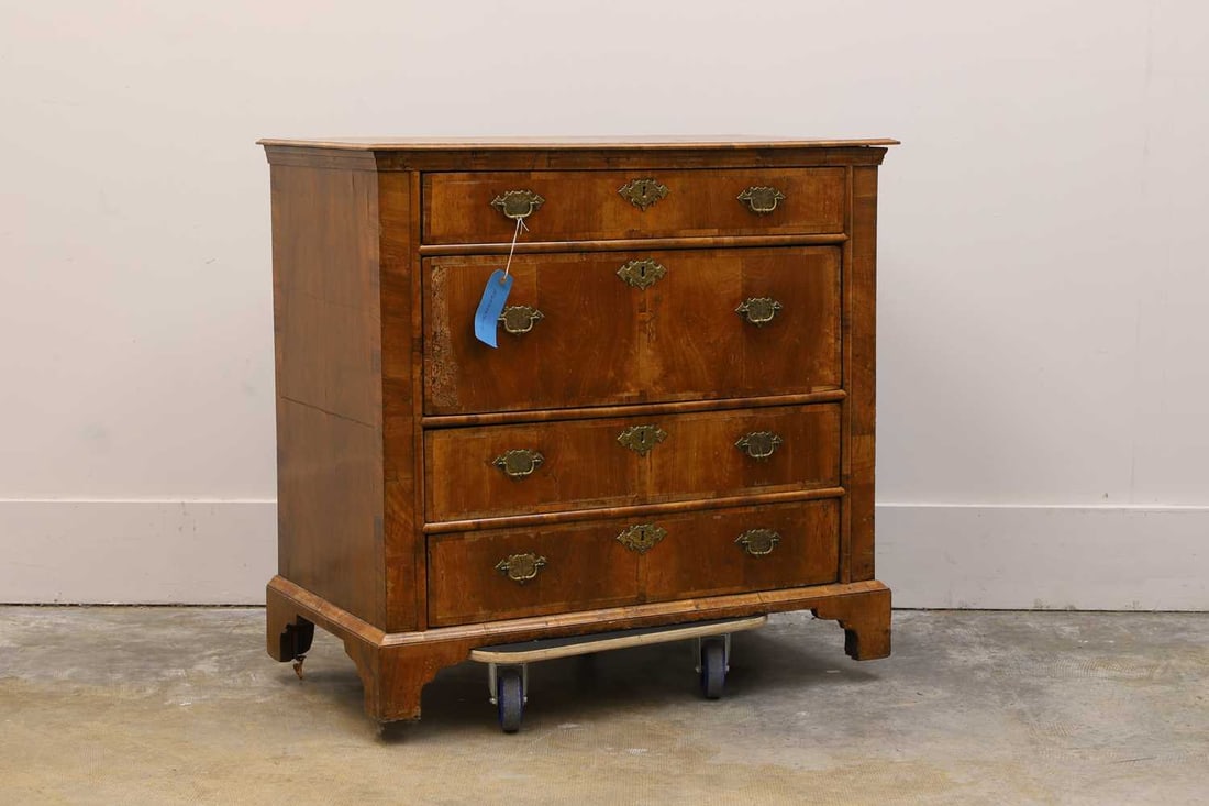 A walnut chest of drawers, 18th century, (1 of 2)