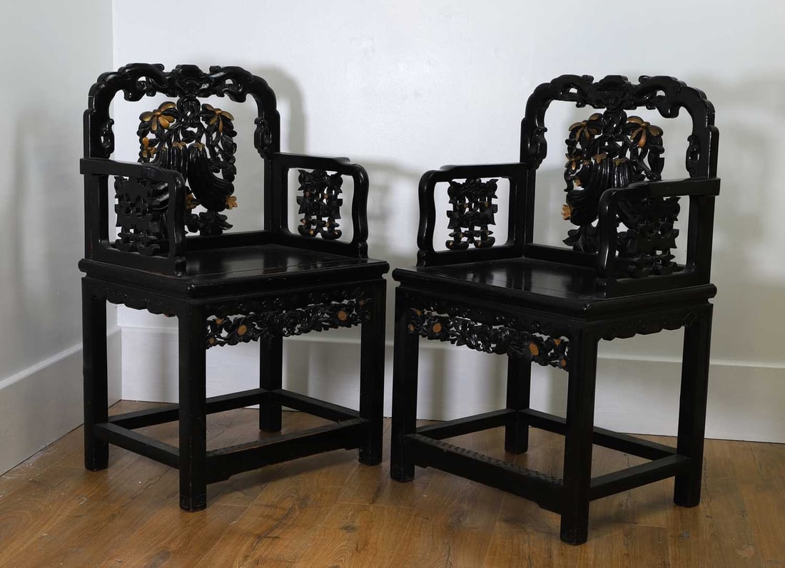 A pair of Chinese chairs, late 19th early 20th century,: A pair of Chinese chairs, late 19th early 20th century, carved and pierced splats and square seats on square supports united by stretchers 64cm wide, 46.5cm deep, 99cm high 2 