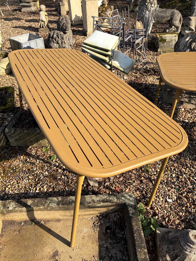 An outdoor dining table, of recent manufacture,: An outdoor dining table, of recent manufacture, finished in a powder coated dijon yellow, a flat, slatted top over four straight tube supports 83 cm wide 180cm long Condition Report: Collection