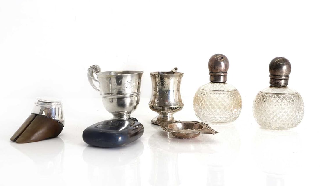 A silver christening mug,: A silver christening mug, London, 1902, in the Georgian style, engraved 'Arthur John Lucas September 1st 1903', a Victorian silver hip flask, engraved with a monogram, a silver-mounted hoof inkwell,