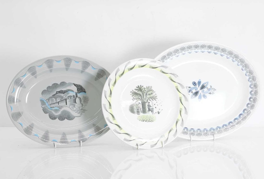 Eric Ravilious (1903-1942) for Wedgwood, 1950s: Eric Ravilious (1903-1942) for Wedgwood, 1950s a group of three Eric Ravilious for Wedgwood ceramics, comprising a 'Garden' plate, 'Travel' platter, together with a 'Persephone' platter, each with