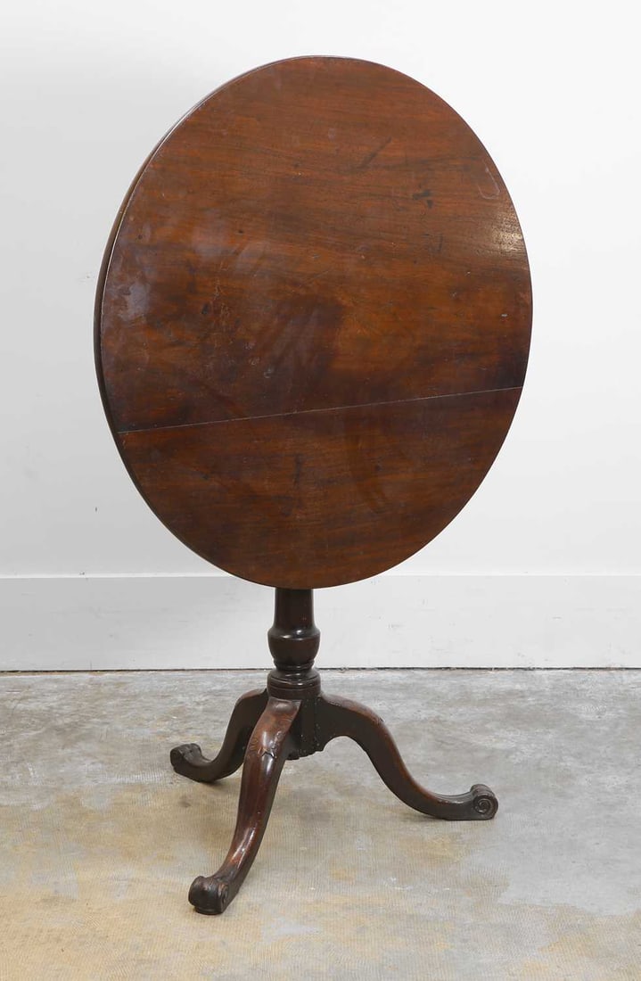 A George III mahogany tripod table, Mid 18th century, (1 of 2)