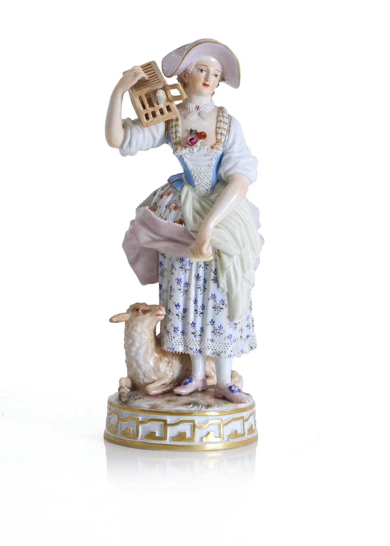 A Meissen figure of a shepherdess holding a birdcage with a lamb, 19th century, (1 of 1)
