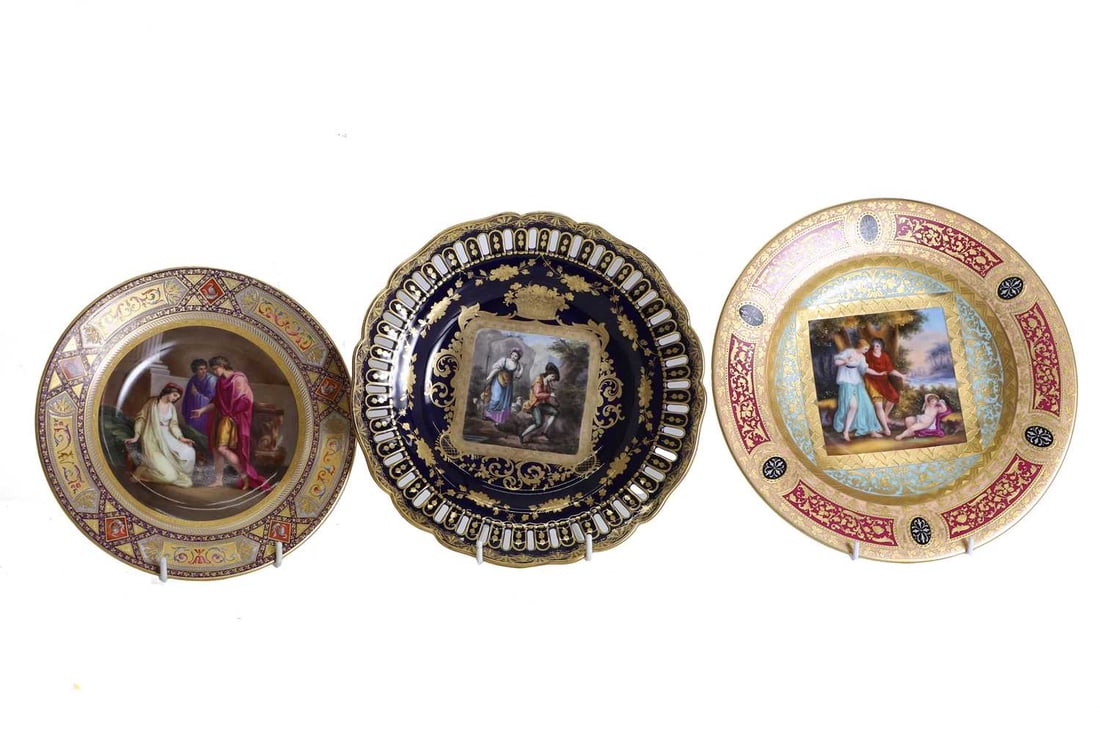 A Vienna ribbon plate, late 19th century,: A Vienna ribbon plate, late 19th century, central field decorated with pastoral scenes and figures, with pierced arched rim, the base with blue painted Vienna mark, and another Royal Vienna