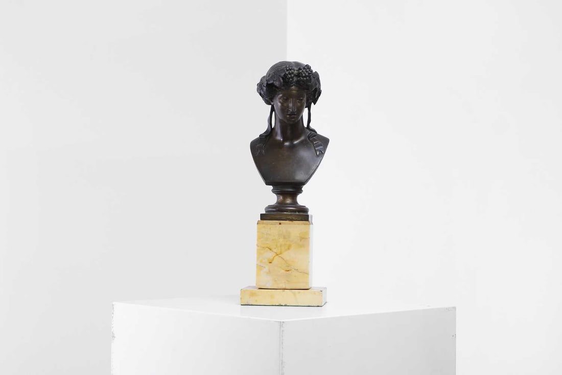 A patinated bronze bust of Dionysus, 19th century,: A patinated bronze bust of Dionysus, 19th century, French, on a Siena marble base 12cm wide 8.5cm deep 35cm high Condition Report: Overall the bust and base are in fair condition but with signs of