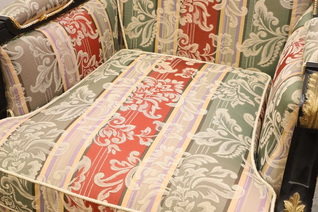 A pair of ebonised and parcel gilt bergère arm chairs, late 19th / early 20th century, - 2