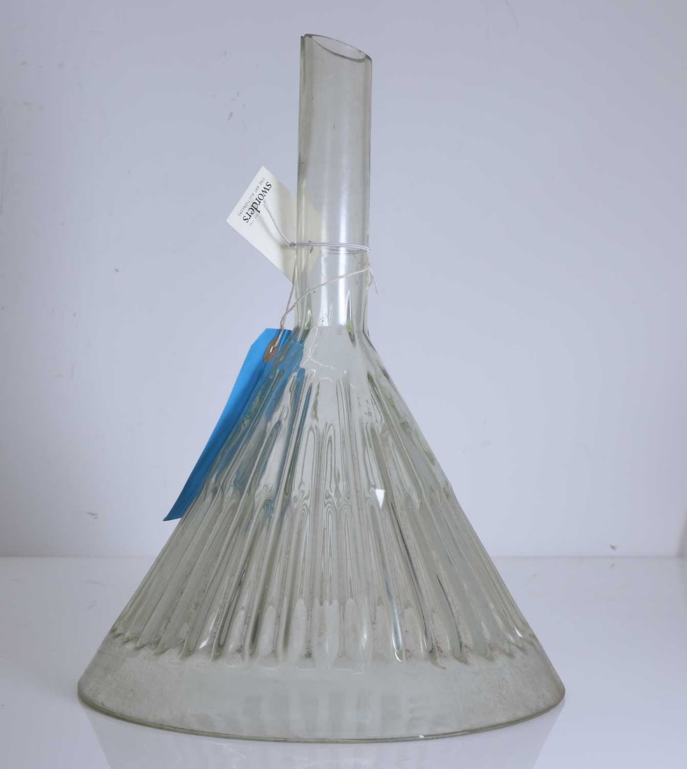 A large clear Simax glass funnel, 20th century,: A large clear Simax glass funnel, 20th century, with alternating ribbed detail 26.5cm diameter, 35cm high Condition Report: General. Scratching to outside, minor chips to rim