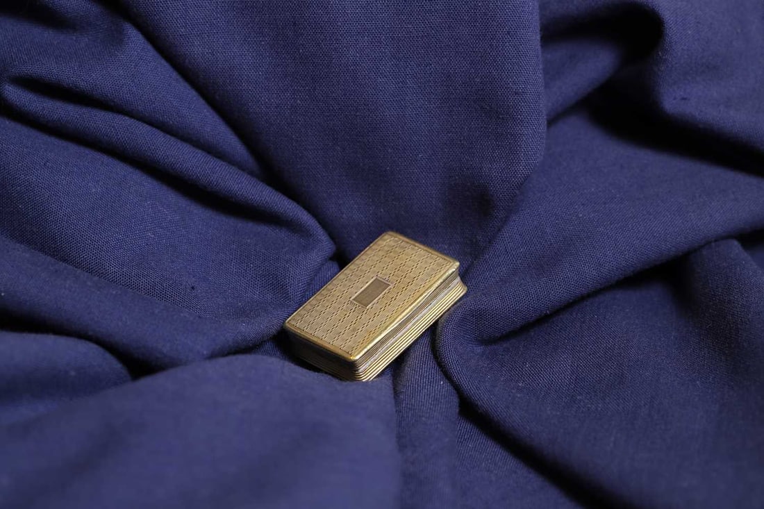 A William IV silver gilt vinaigrette,: A William IV silver gilt vinaigrette, by William Simpson, Birmingham 1835, with engine turned decoration enclosing a gilt interior and pierced grille, complete with its original box vinaigrette