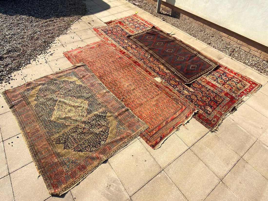 A group of five Persian rugs, 19th to 20th century, (1 of 4)