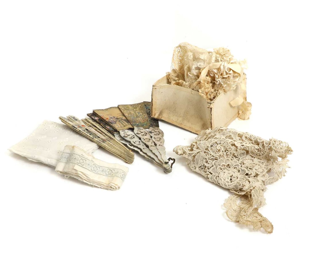 A collection of linen and lace items, late Victorian and later,: A collection of linen and lace items, late Victorian and later, to include a linen and embroidered smock, two boxes of trimmings, a box inscribed 'Confirmation / Wedding veils and Orange blossom,