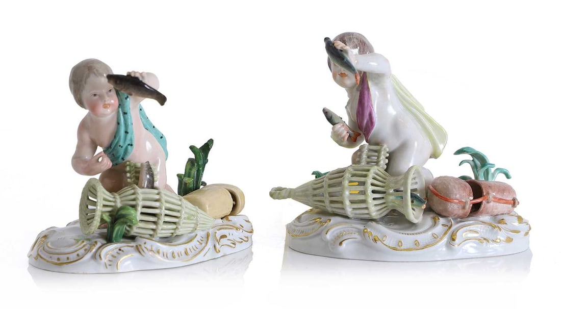 A Meissen figure of a putto, late 19th century,: A Meissen figure of a putto, late 19th century, modelled draped in a turquoise sash, kneeling beside a wicker fish basket issuing a catch, a fish held aloft in his right hand, the base of