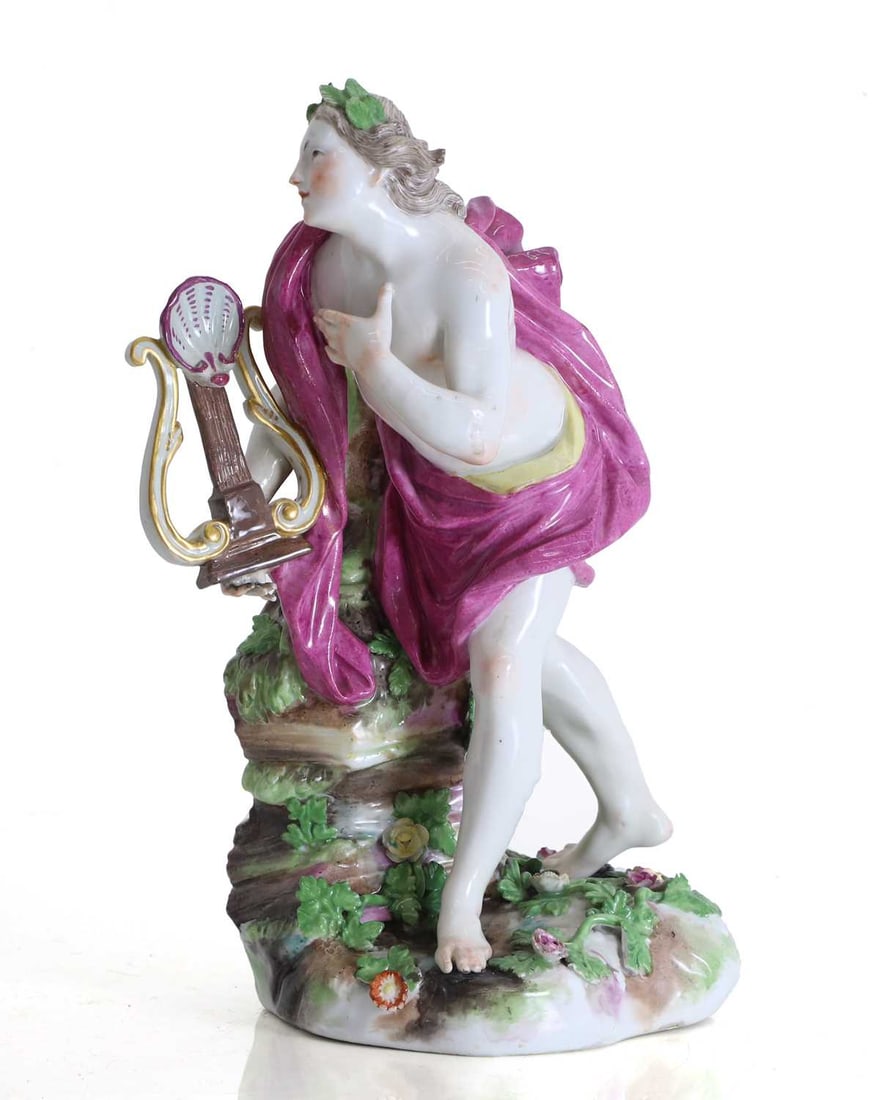 A Derby porcelain figure of Orpheus, early 19th century,: A Derby porcelain figure of Orpheus, early 19th century, modelled as Orpheus, the mythological poet and musician, standing barefoot beside a tree stump, a puce drape flowing over his shoulders and