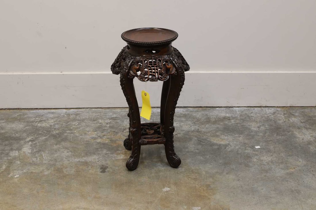 A Chinese cherry wood heavily carved jardiniere stool, 20th century, - 2