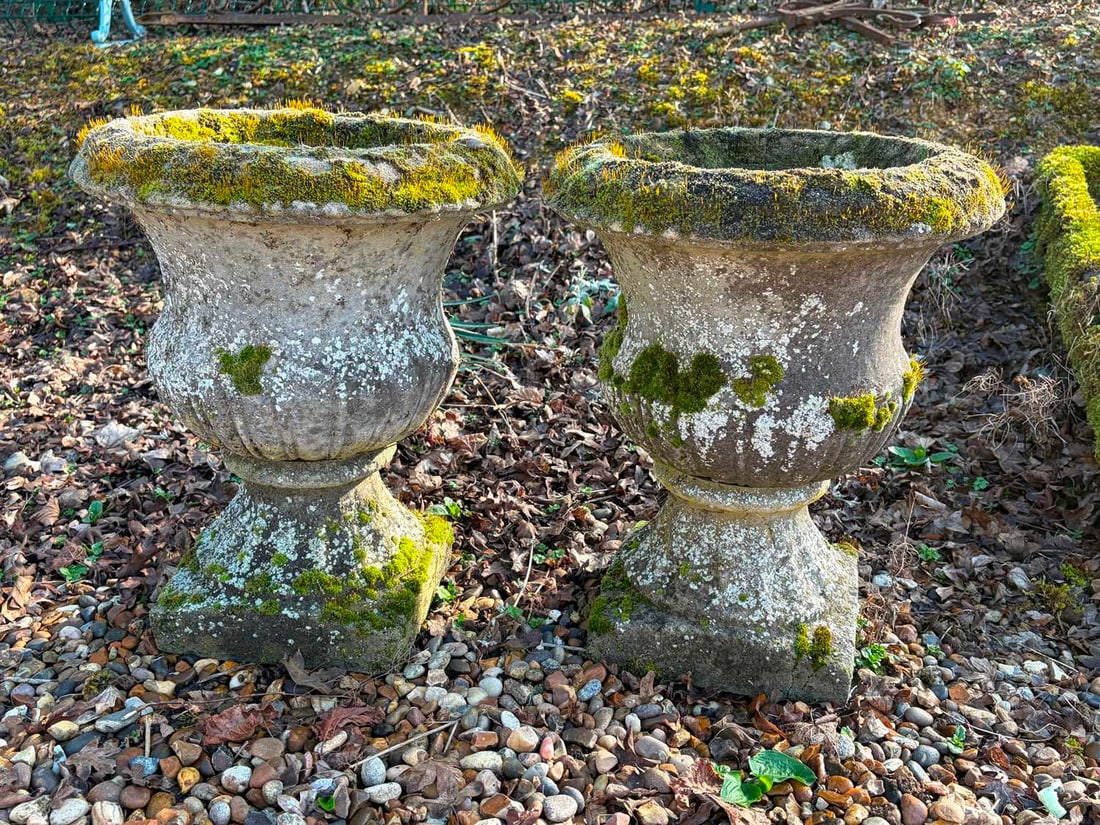 A pair of composite campagna urns, 20th century,: A pair of composite campagna urns, 20th century, on square bases, with fluted moulding 42cm wide, 53cm high 2