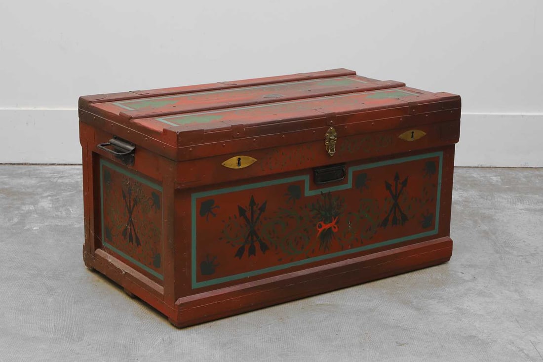 'The Marshall Improved Air & Water-Tight Chest', 20th century,: 'The Marshall Improved Air & Water-Tight Chest', 20th century, painted in blues and greens with scrolling foliage and arrows, to a red ground, with two locks and carrying handles, on casters 