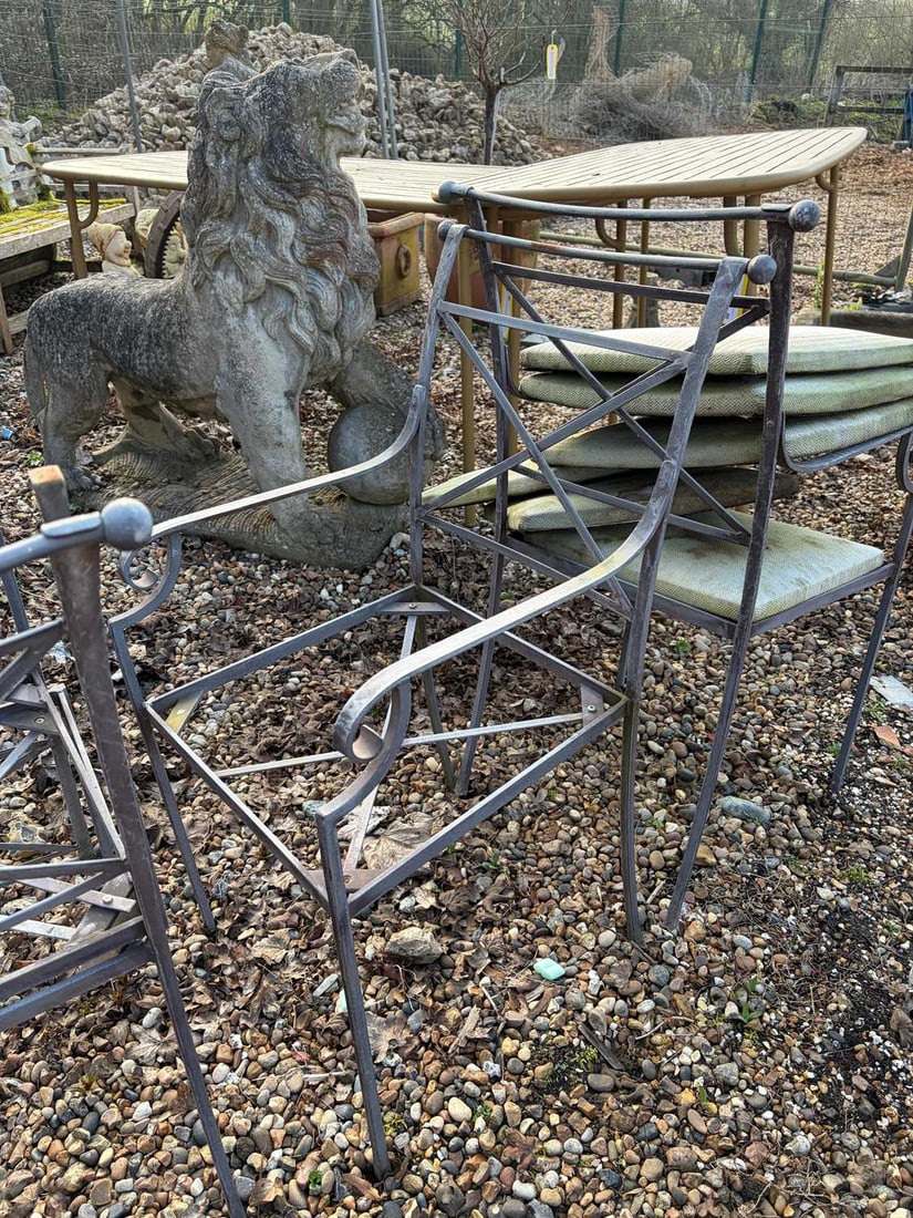 A set of six iron chairs, Of recent manufacture,