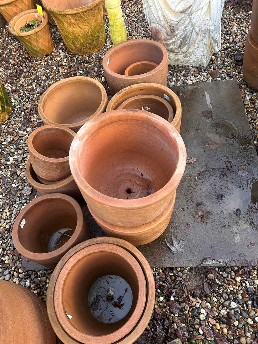 A large collection of terracotta pots, 21st century,: A large collection of terracotta pots, 21st century, with a grooved banded design to the exterior qty.