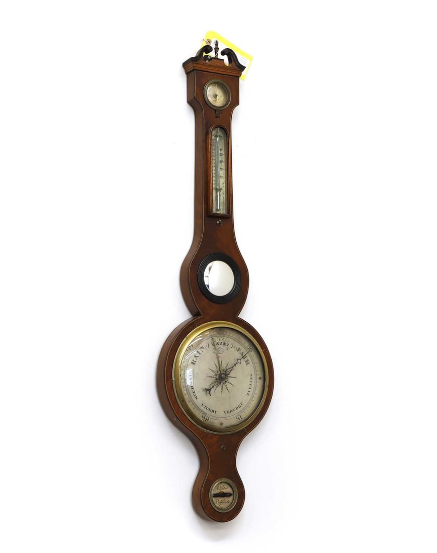 A mahogany barometer, 19th century,: A mahogany barometer, 19th century, with a silvered dial, engraved 'A Silo, Belfast' 99cm high 1 Condition Report: Lacking glass panel to the level. Some spotting to the dials.
