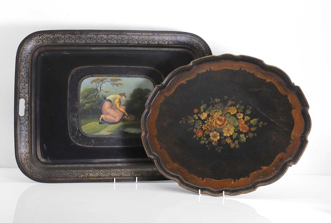 Two painted trays, 19th century,: Two painted trays, 19th century, the toleware rectangular tray, with rounded corners, the black ground decorated with gilt foliate borders, centred by a painted vignette depicting a young woman