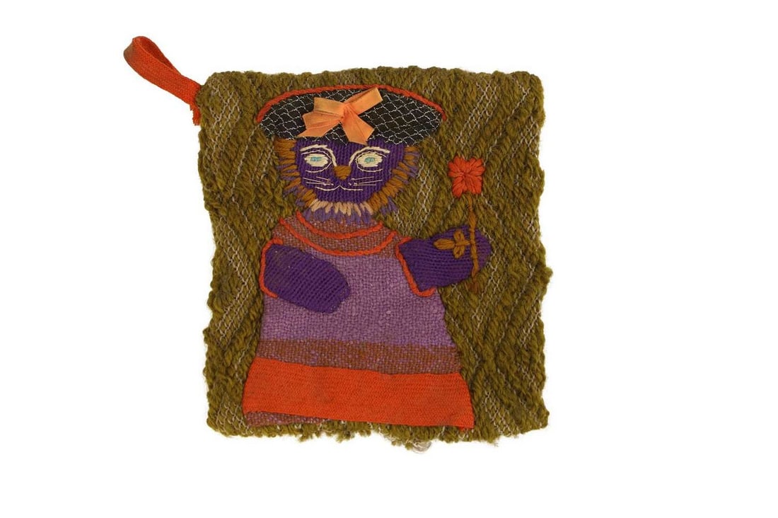 ▲ Mary Fedden RA (British, 1915-2012) A rare tapestry pot holder with lion design: ▲ Mary Fedden RA (British, 1915-2012) A rare tapestry pot holder with lion design fabric, wool and ribbon (19 x 18cm) Provenance: The estate of the late RDV Garnett, whose mother, [Ida] Nancy, w