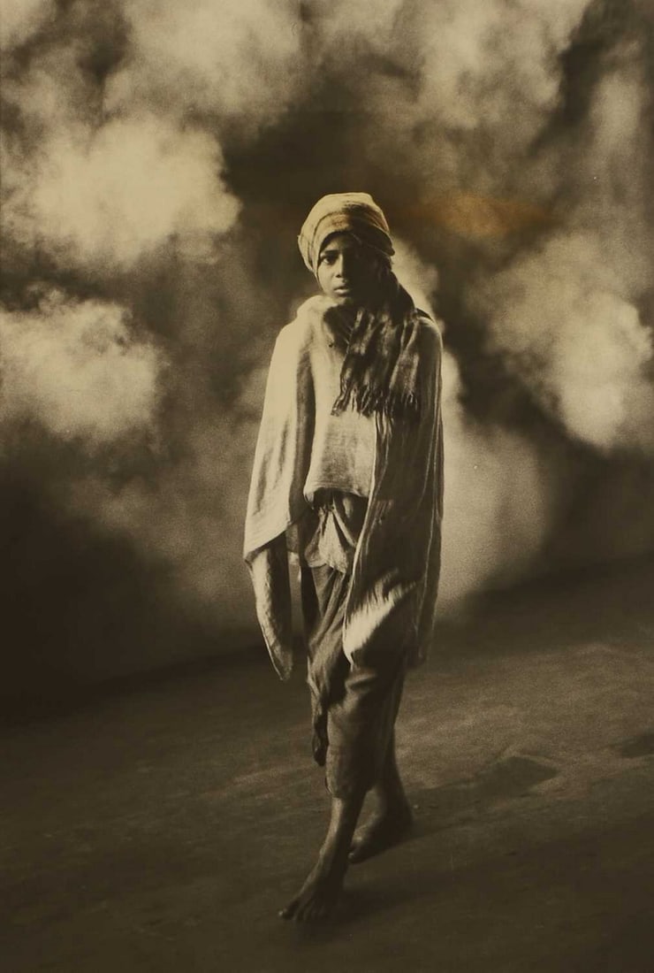 Carlos Freire (Brazilian, b.1945) 'Young Man at Calcutta Train Station', 1978: Carlos Freire (Brazilian, b.1945) 'Young Man at Calcutta Train Station', 1978 gelatin silver print, signed 'Carlos Friere' in pencil, inscribed with title and dated to mount (120 x 80cm; framed 152 x