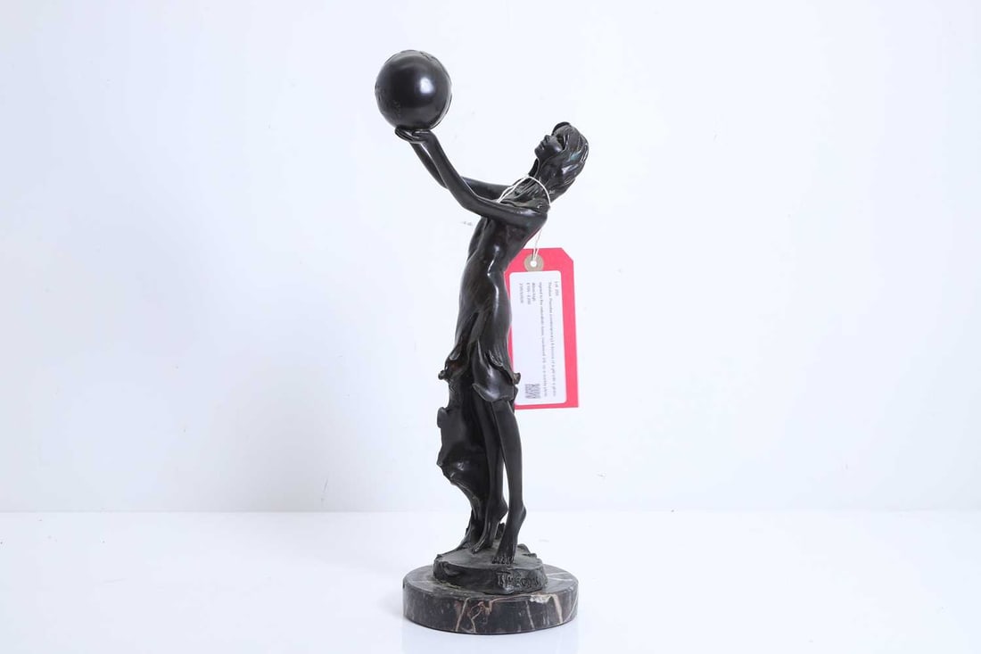 Thérèse Theodas (contemporary), a bronze of a girl with a globe,: Thérèse Theodas (contemporary), a bronze of a girl with a globe, signed to the naturalistic base, numbered 3/9, on a marble plinth 40cm high Condition Report: Loose on the marble