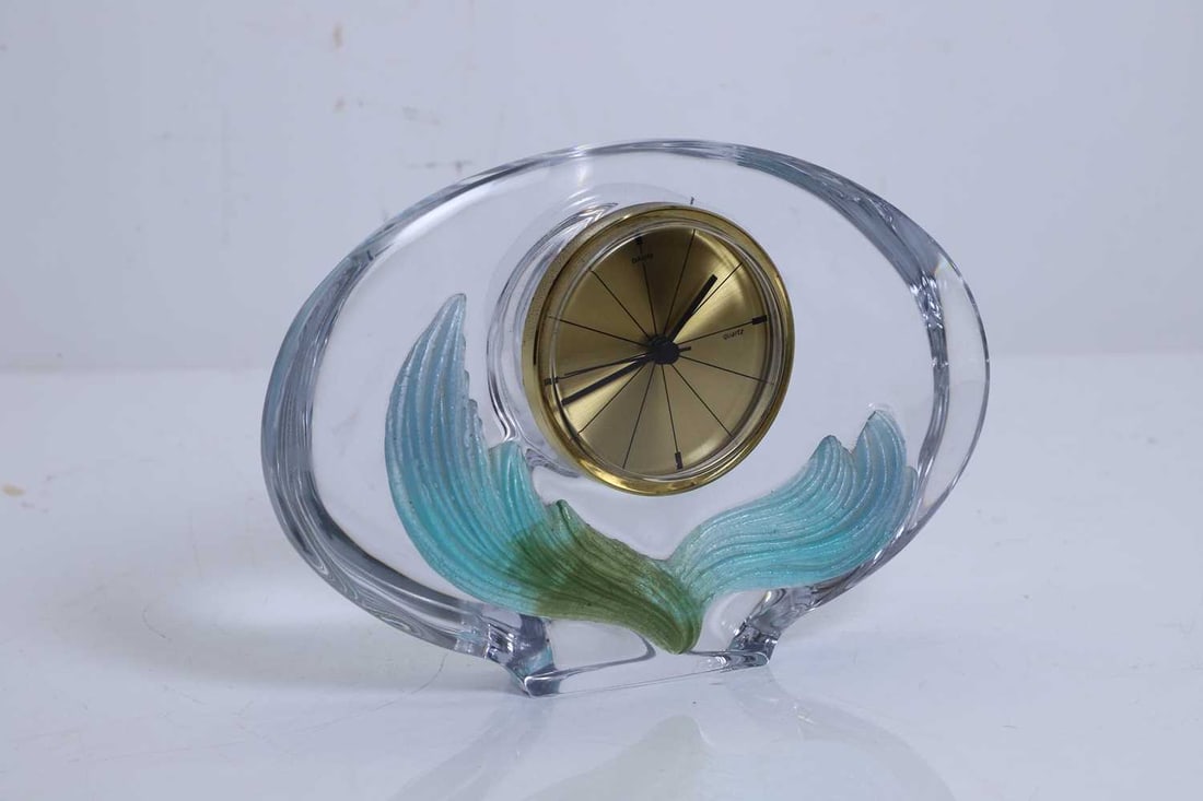 A Daum glass clock,: A Daum glass clock, with gilt dial inscribed 'DAUM quartz' and the base inscribed 'Daum France', with blue and green wave to the front, a Baccarat paperweight, stamped top the side, and a J.G. Duran