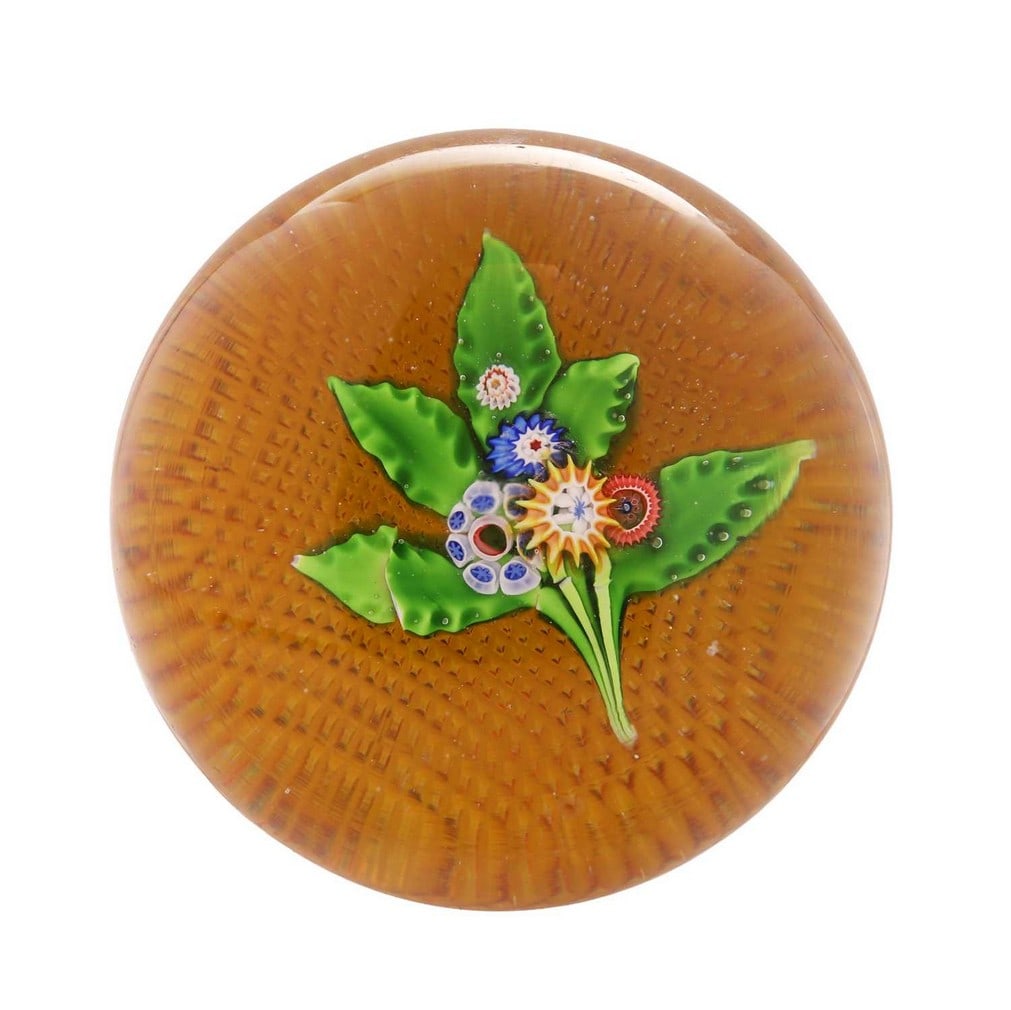 A St Louis glass bouquet paperweight, circa 1850, French,: A St Louis glass bouquet paperweight, circa 1850, French, with a lampwork floral spray above a diamond-cut base (8.2cm diameter, 4.9cm high) Condition Report: Surface scratches to the dome. Small nume