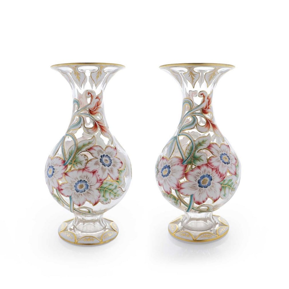 A pair of cased and cut-glass vases, circa 1870, Bohemian,: A pair of cased and cut-glass vases, circa 1870, Bohemian, each of footed baluster form, cased in opal over clear glass, cut with floral sprays, heightened with enamels and gilding (16.5cm diameter, 3
