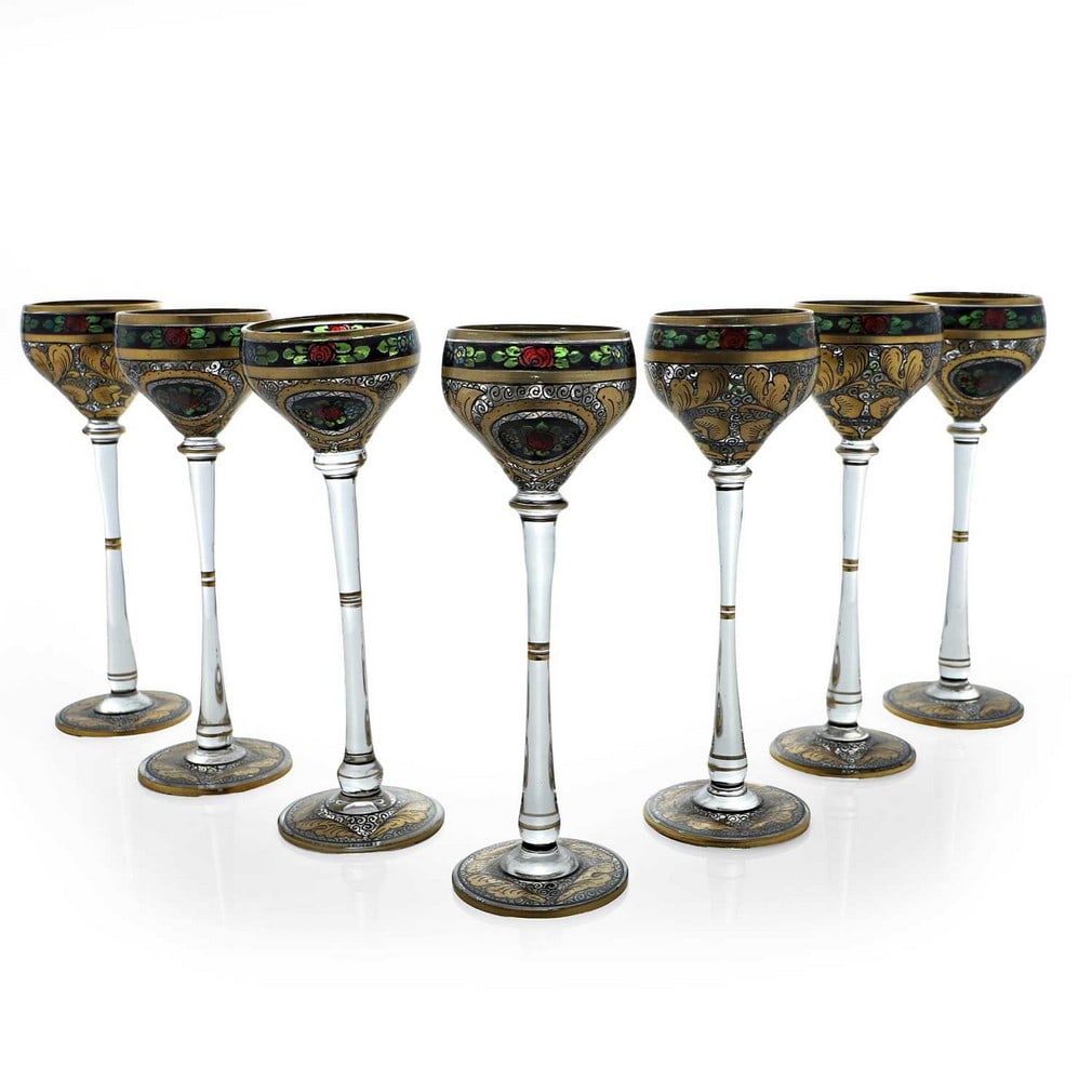 A set of seven Julius Mühlhaus liqueur glasses, circa 1910, Czech,: A set of seven Julius Mühlhaus liqueur glasses, circa 1910, Czech, the decoration attributed to Hermann Pautsch, each enamelled and gilt with floral motifs (4.8cm diameter, 14cm high) (7) Conditi