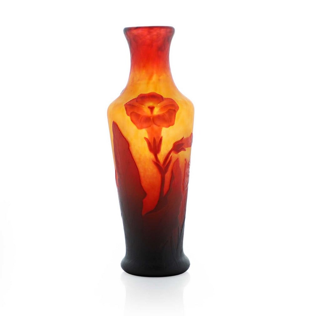 A Daum cameo glass vase, circa 1900, French,: A Daum cameo glass vase, circa 1900, French, cased and etched with flowers, possibly nicotiana, in orange and red tones, cameo signature 'Daum Nancy' with the cross of Lorraine (6cm diameter, 16.1cm h
