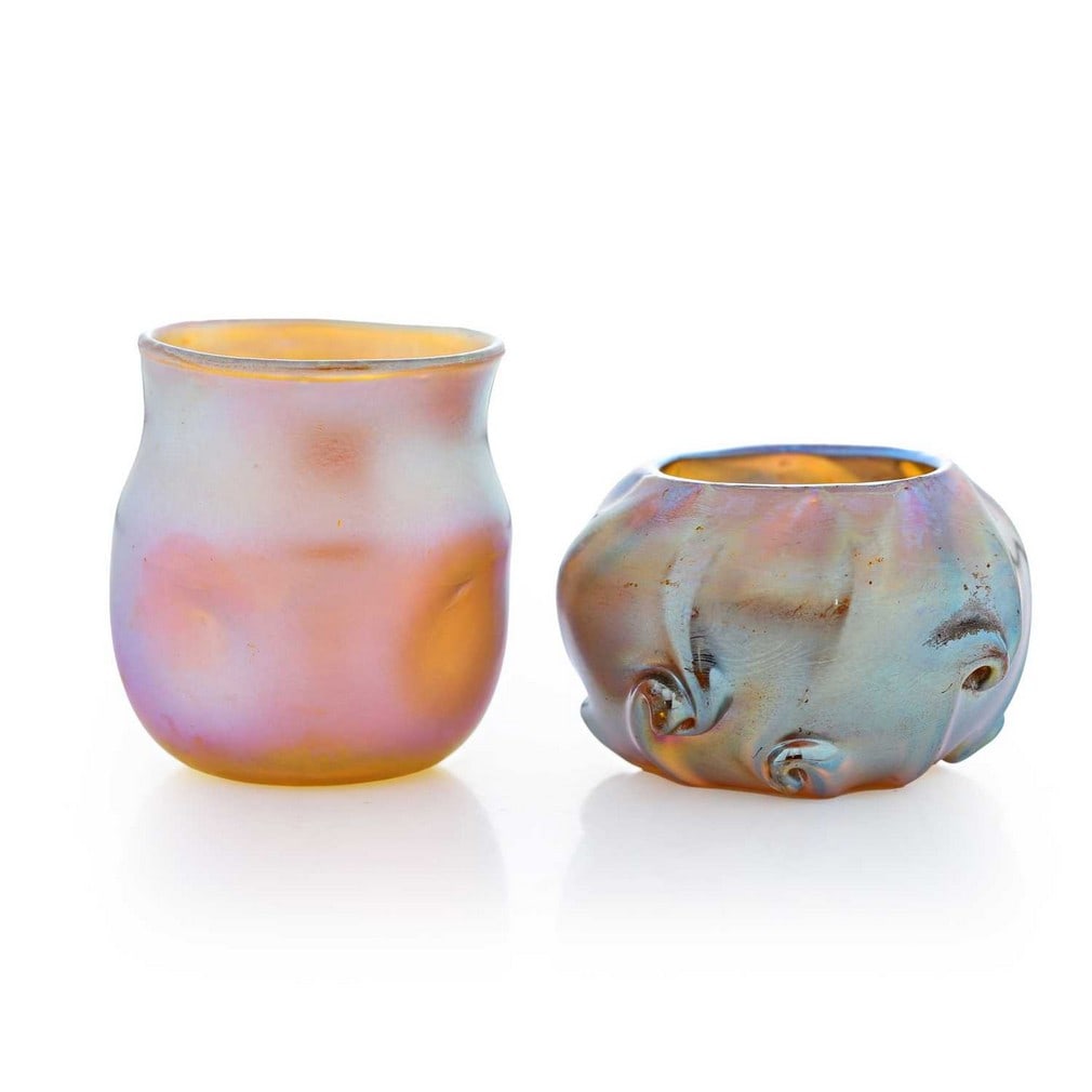 A Tiffany Favrile miniature glass vase, circa 1900, American,: A Tiffany Favrile miniature glass vase, circa 1900, American, with dimpled decoration and a gold iridescent finish, engraved signature 'L.C.T. Q3320', together with a similar miniature vase, with moul