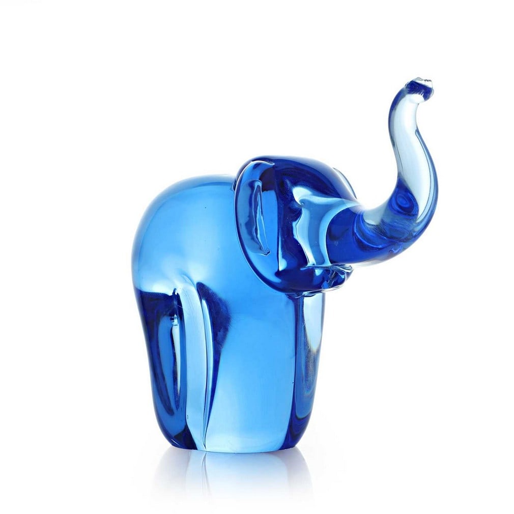 Ray Annenberg (British, b.1937) for Whitefriars, an elephant paperweight, circa 1980,: Ray Annenberg (British, b.1937) for Whitefriars, an elephant paperweight, circa 1980, in Sky Blue, blown glass (16cm wide, 7.5cm deep, 14.5cm high) Condition Report: Small chip to the end of the trunk