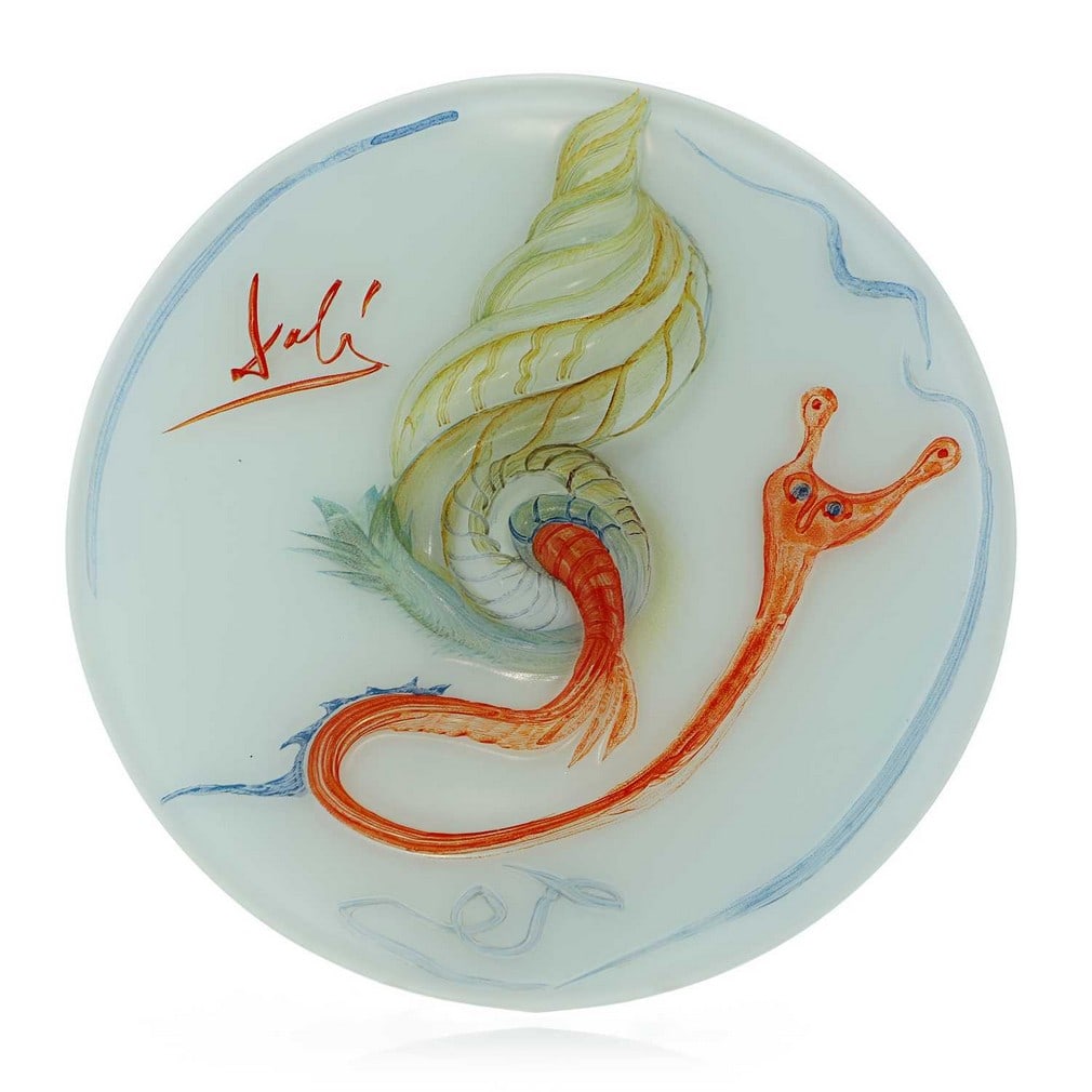 Salvador Dali (Spanish, 1904-1989) for Rosenthal, a painted glass charger, 1979,: Salvador Dali (Spanish, 1904-1989) for Rosenthal, a painted glass charger, 1979, depicting a coloured snail in bas-relief to a translucent white ground, mounted on a circular brushed aluminium base, n