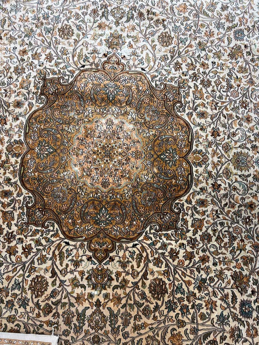 A Persian design part silk rug, - 2