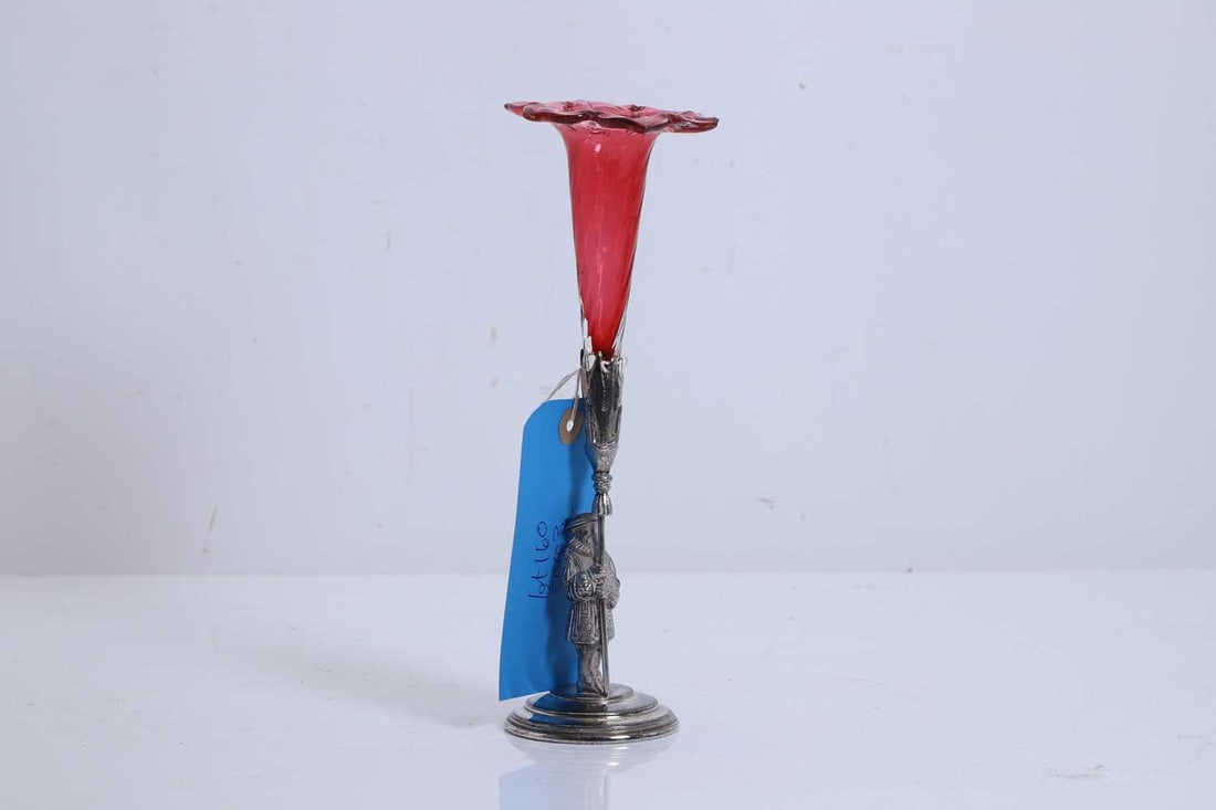 A glass and silver plated epergne,: A glass and silver plated epergne, with figural column design as a Yeoman Warder, with floral shaped cranberry glass reserve 9cm wide, 24cm high 2